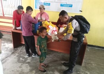 Polres Fakfak Kawal Distribusi 299 Paket Makanan Bergizi Gratis di Fakfak