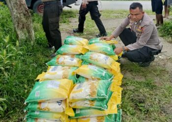Polsek Kurulu Salurkan Beras Sphp Dalam Rangka Gerakan Pangan Murah di Distrik Usilimo